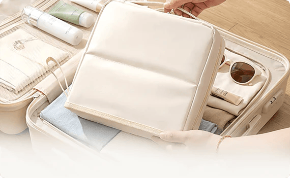 Closed organizer being packed into a suitcase